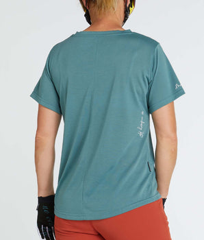 A photo of the back of the Thrills Tech Tee, showing "No Ordinary Life" and the DHaRCO logo printed near the right sleeve.